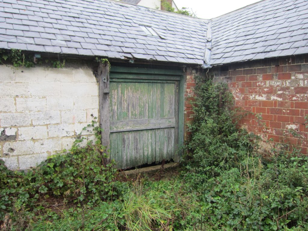 Entrance to a disused dairy shed 